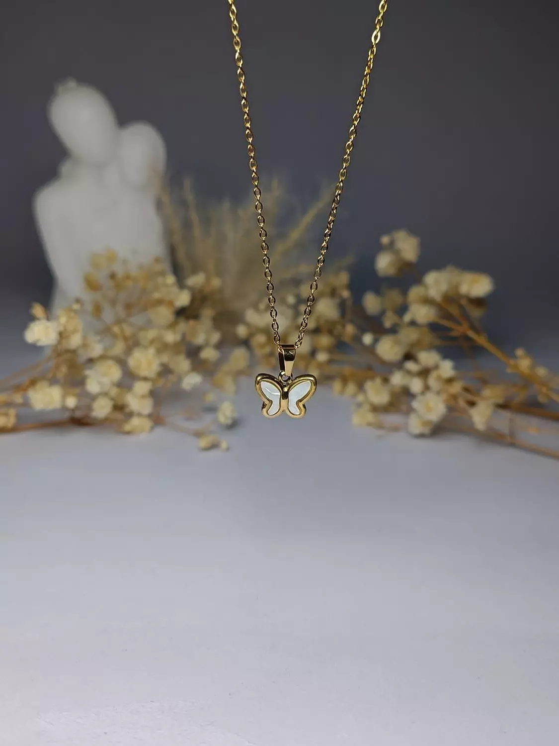 white stone butterfly necklace image