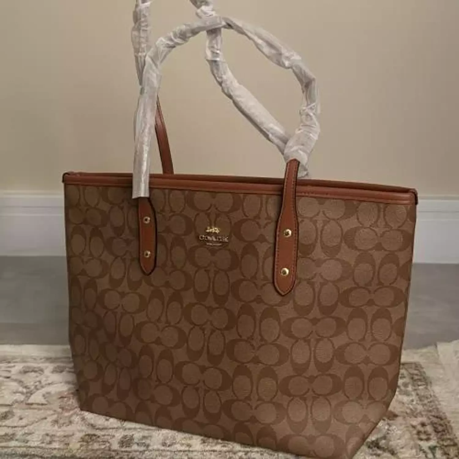 Coach city tote bags available in signature canvas brown 1