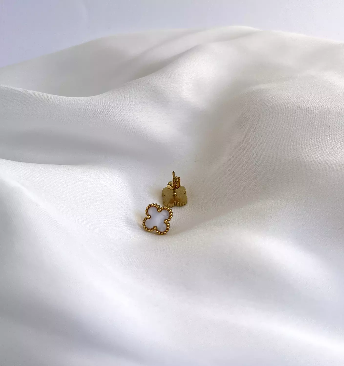 White pearl van cleef studs image