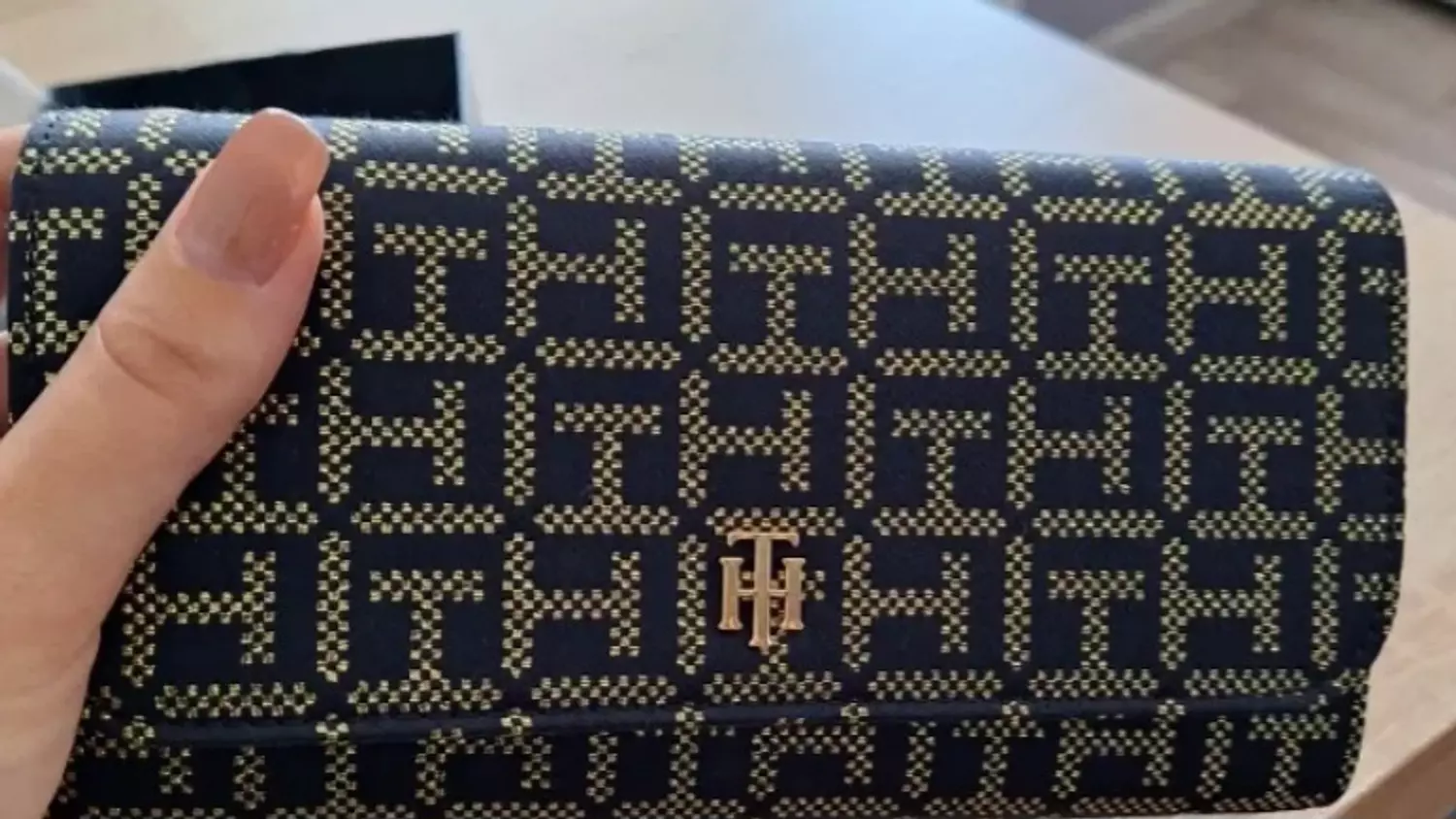 A  sleek envelope _style clutch or long  wallet  image