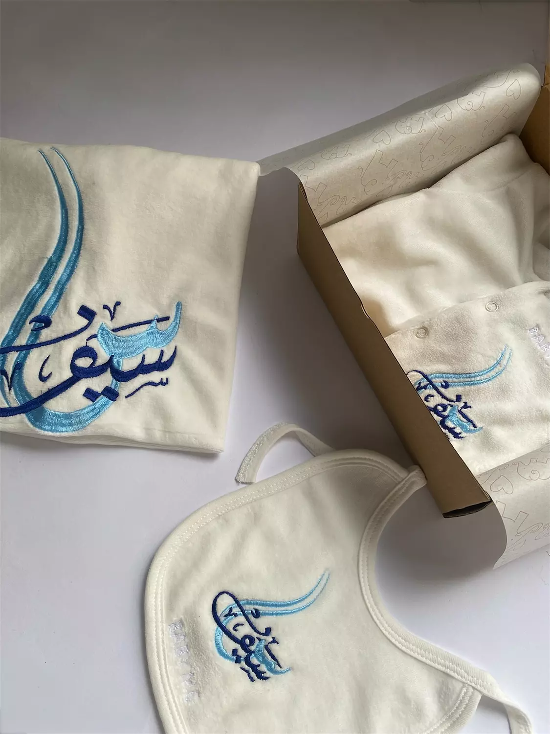 Blue letter + name embroidery design  image