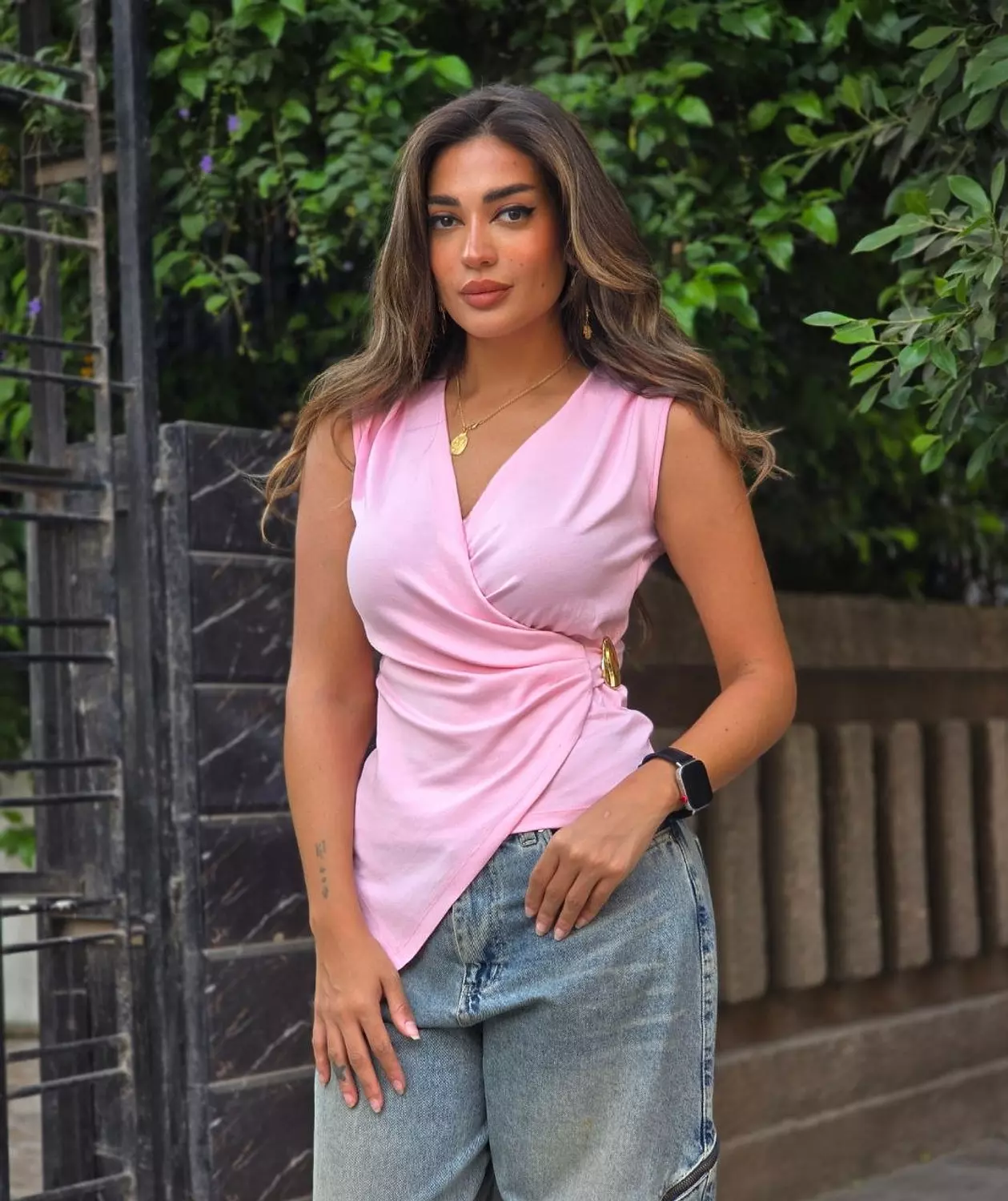 Pink top with gold accessory  hover image