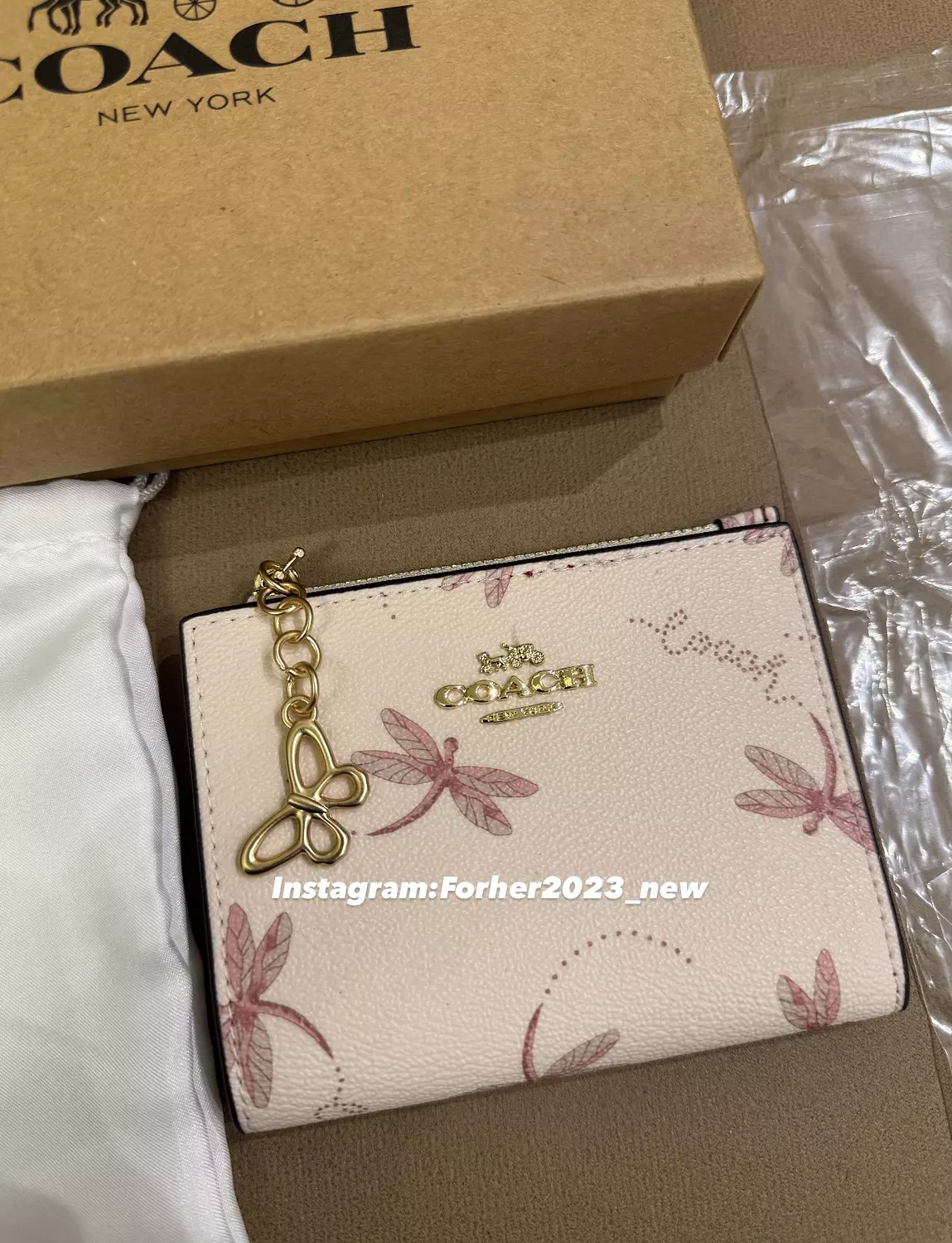Coach bifold wallet with butterflies image