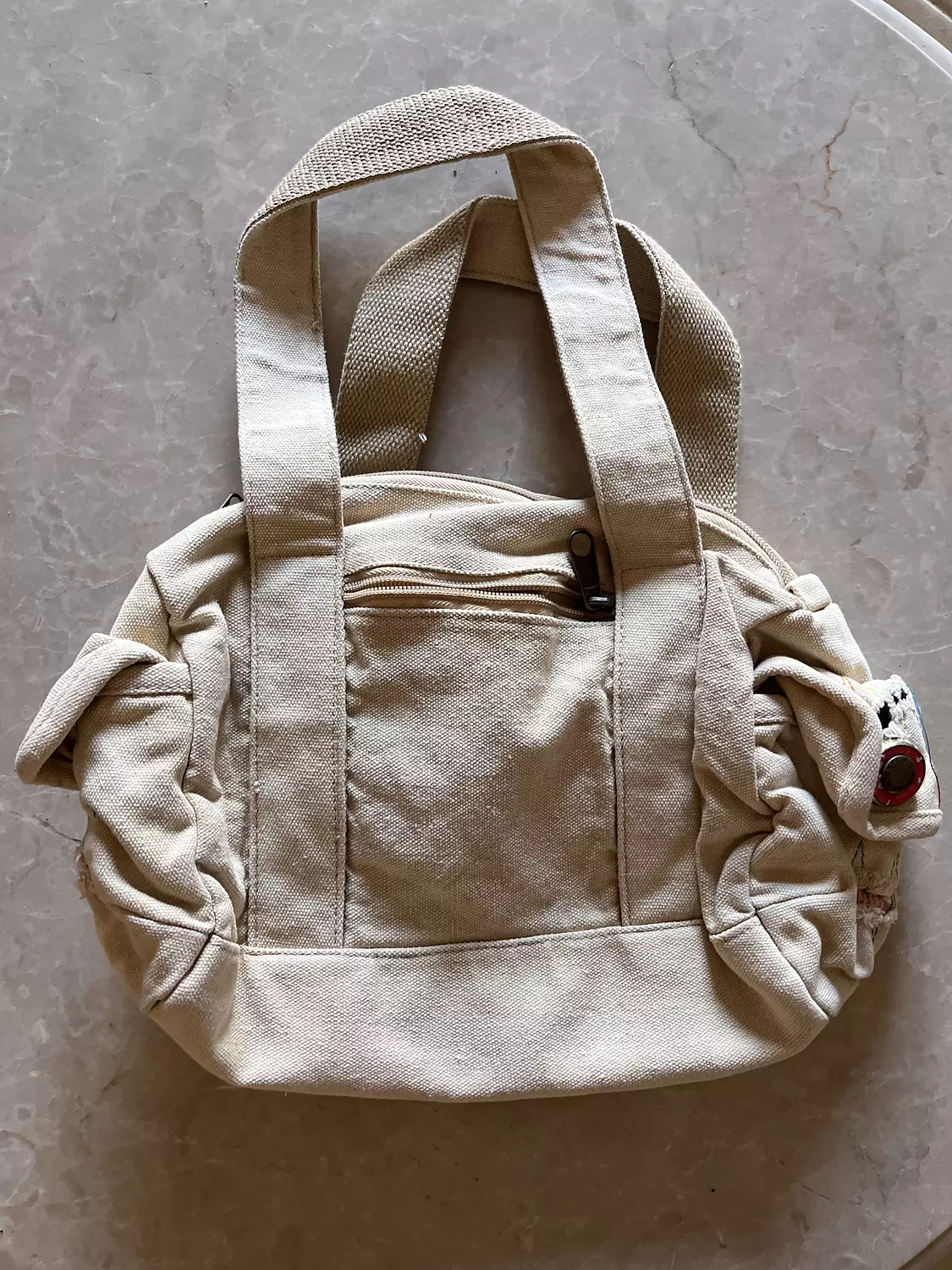 Beige ribbed diesel bag with adjustable buttons  hover image
