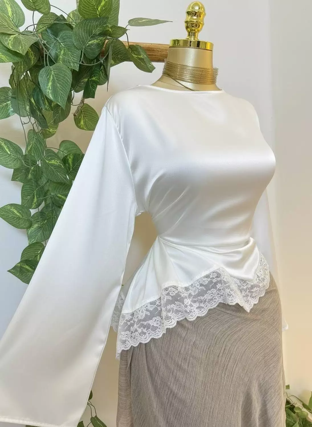 <p style="text-align: start">Lace-trim satin blouse</p>