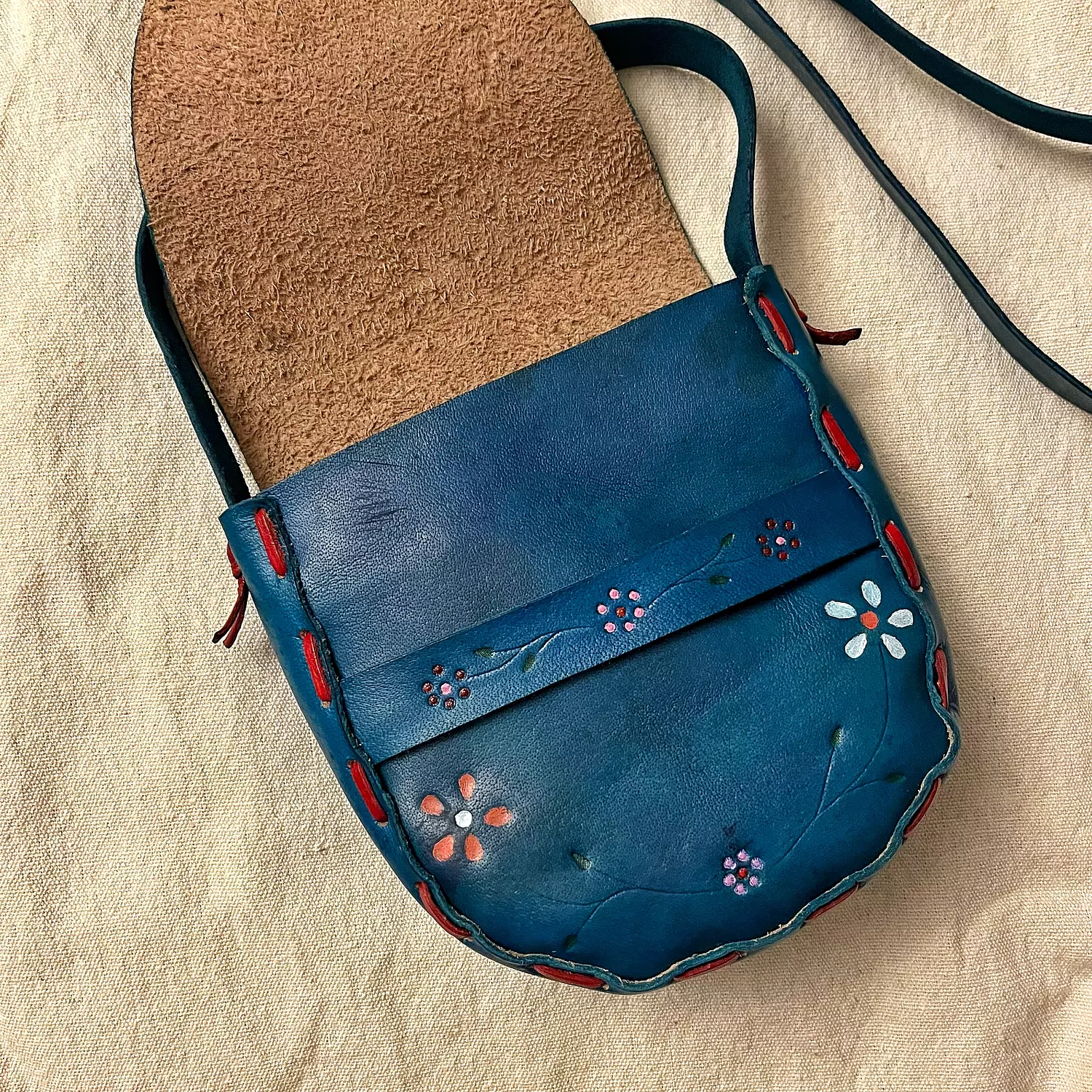 Colorful flowers leather bag with closure strap hover image