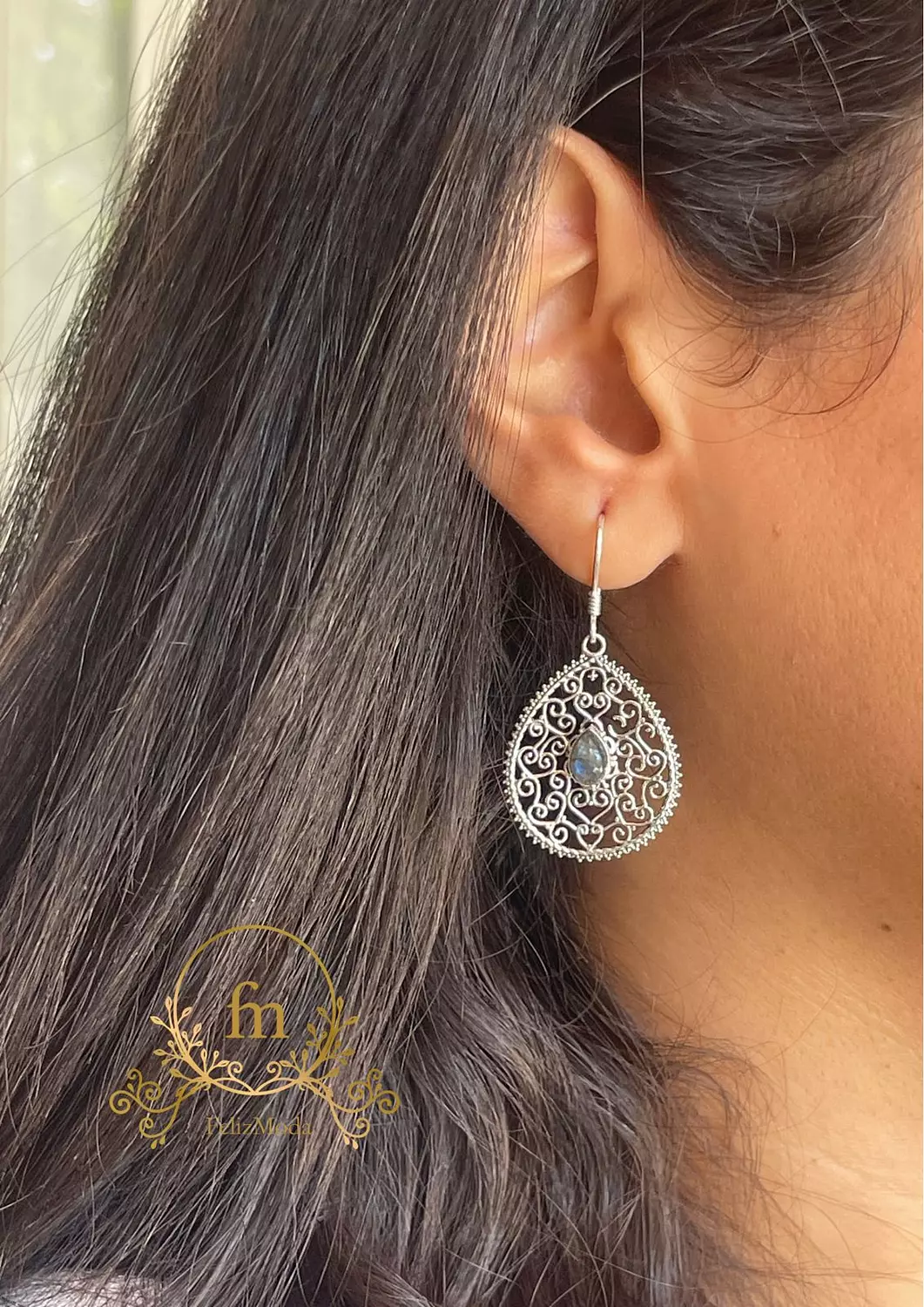 Unique designed silver earrings with gray stone image