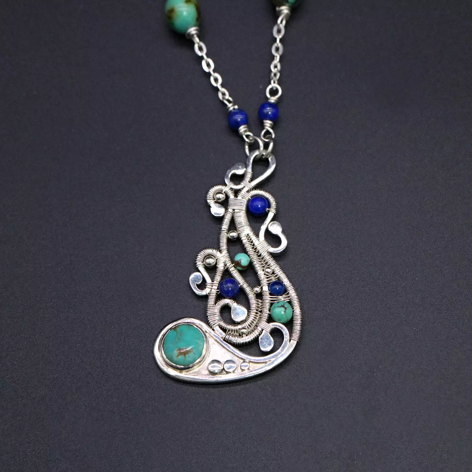 Wire wrapped silver necklace with turquoise and Lapis lazuli gemstones. image