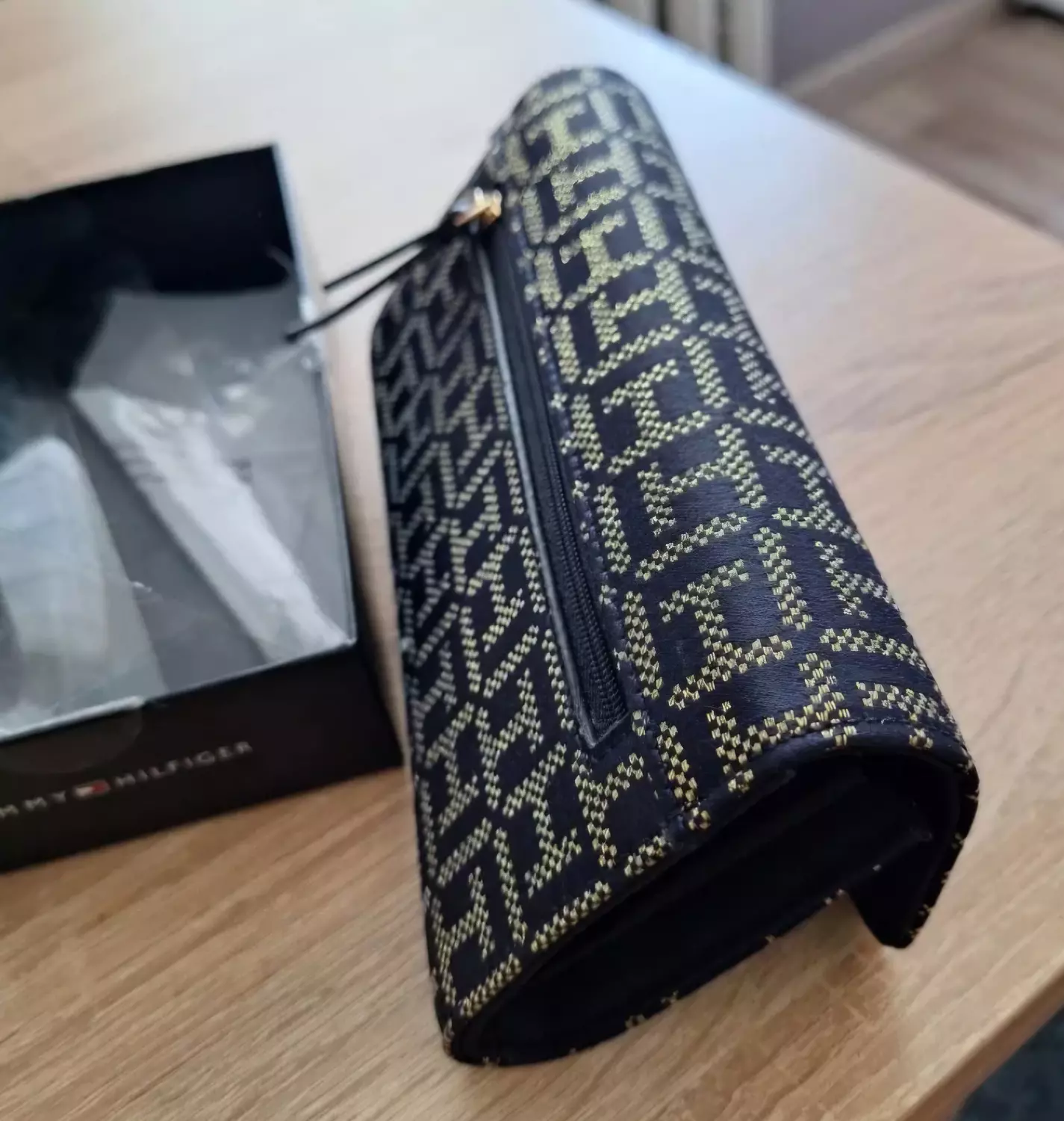 A  sleek envelope _style clutch or long  wallet  hover image