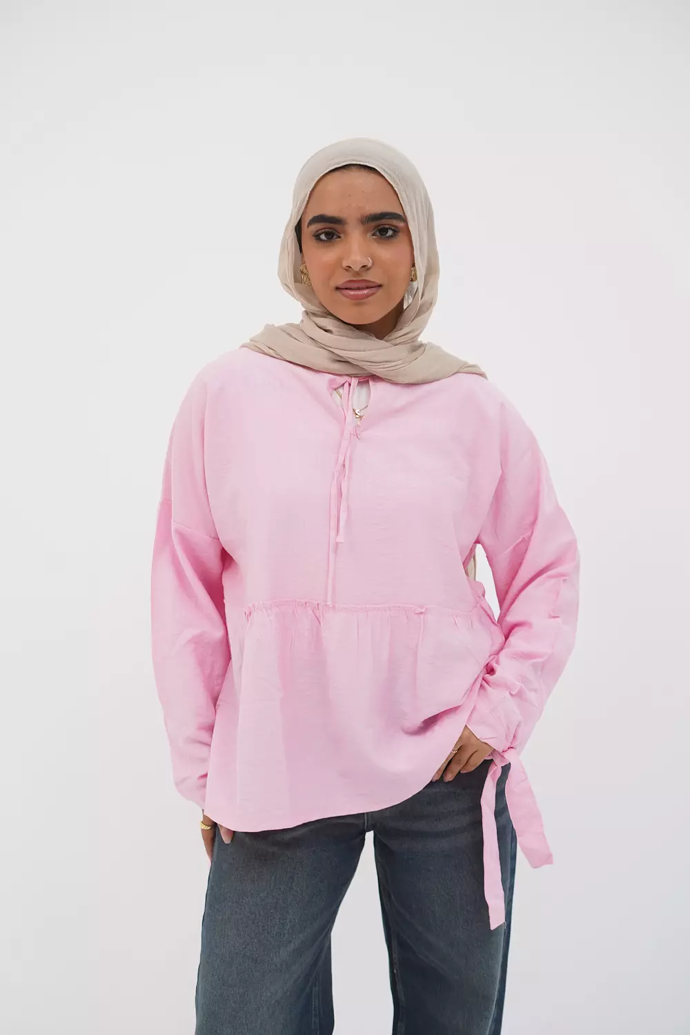 Pink blouse with tie from the collar image