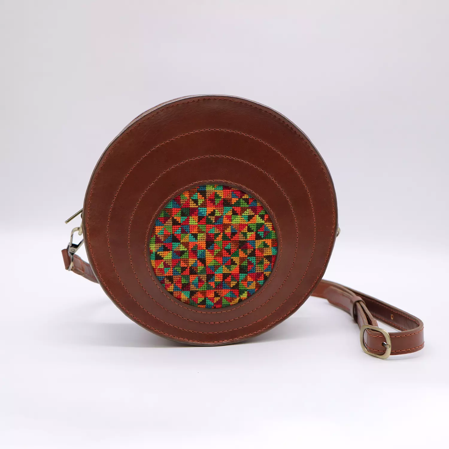Havana circle genuine leather bag with colorful cross-stitching. image