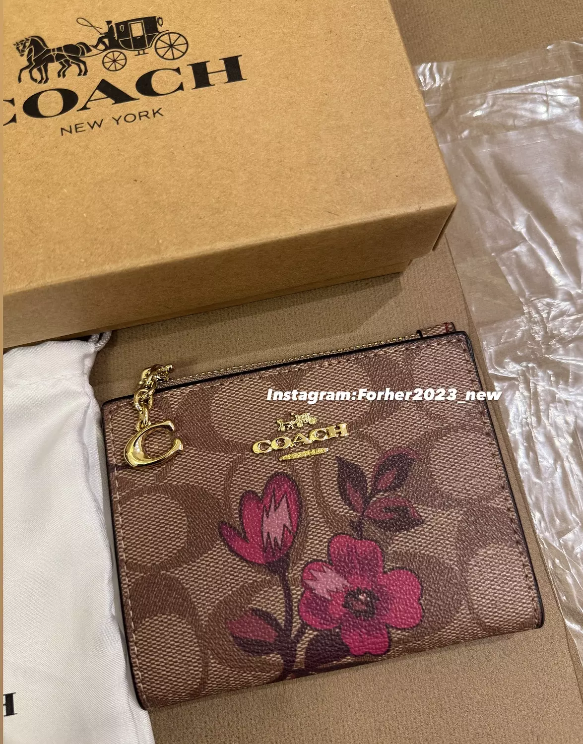 Coach bifold wallet light brown with pinkish flowers  image