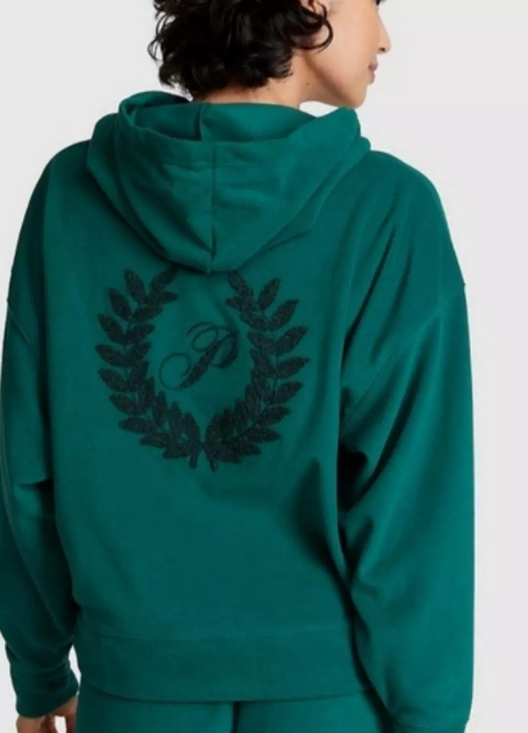 A modern, oversized women's hoodie with a clean, minimalist design. hover image