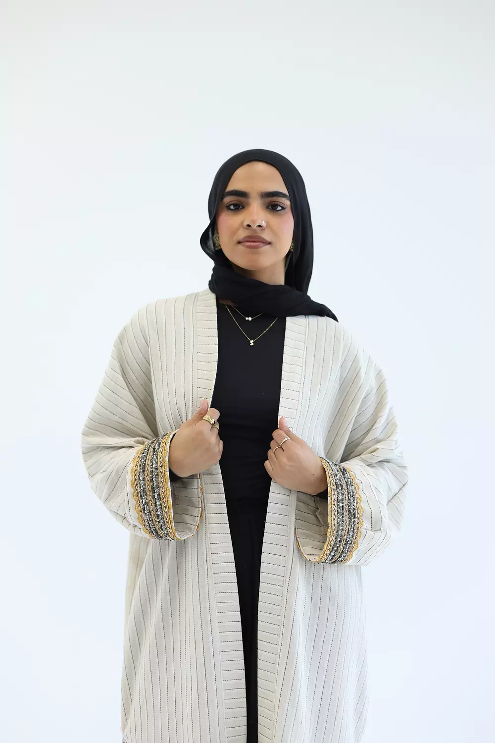 Striped cardigan with gold bracelet 3