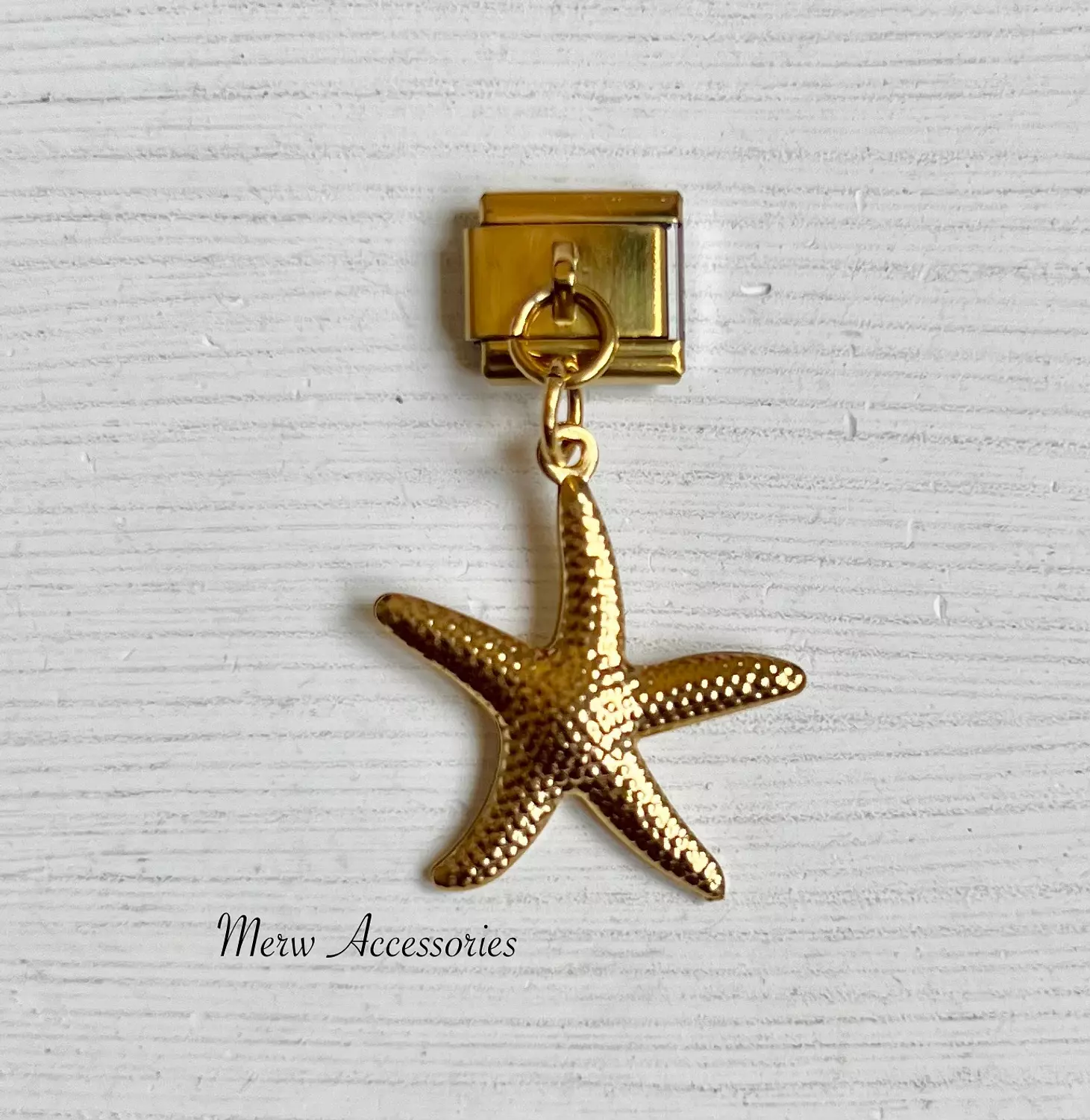 Gold starfish charm image