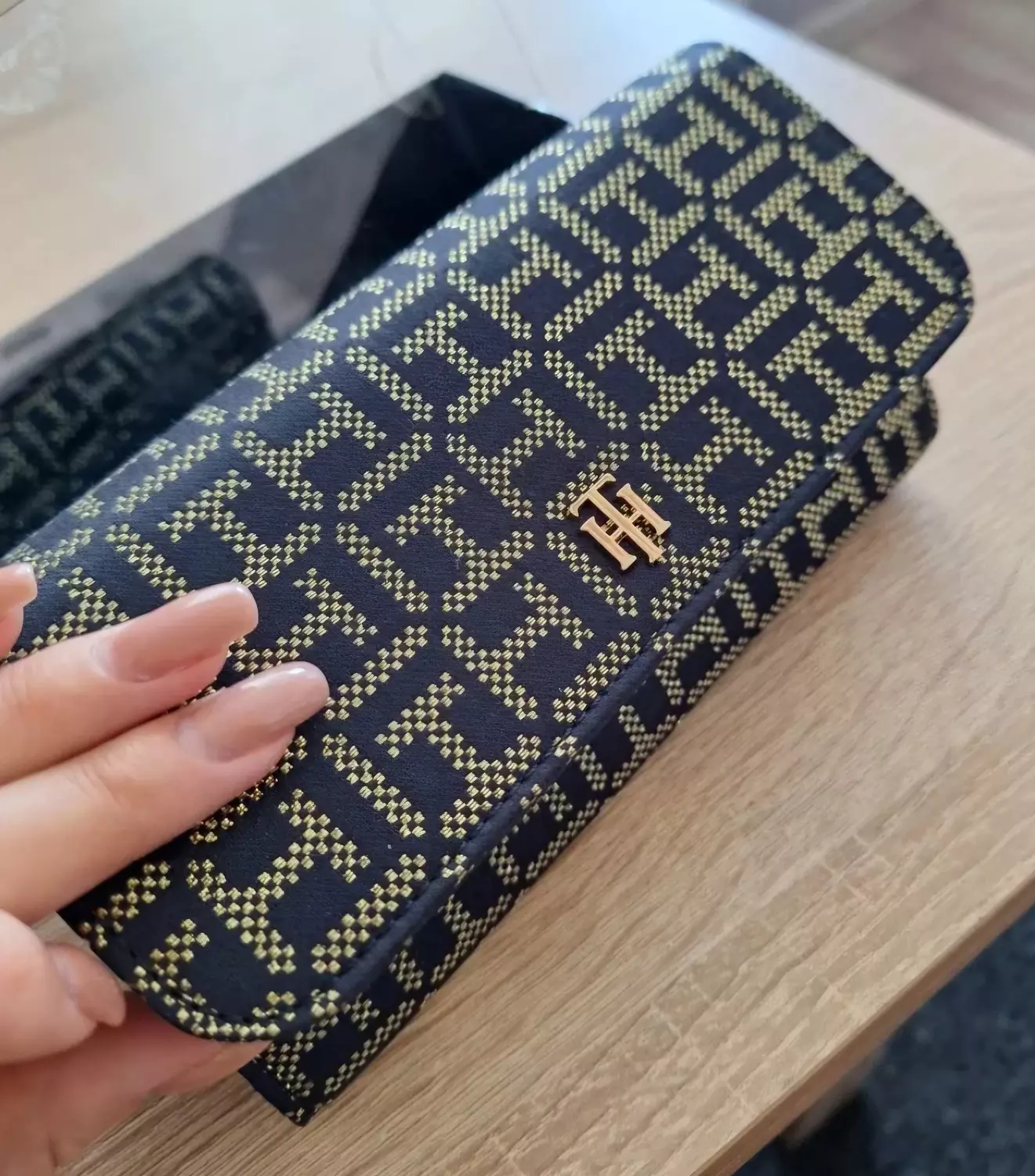 A  sleek envelope _style clutch or long  wallet  3