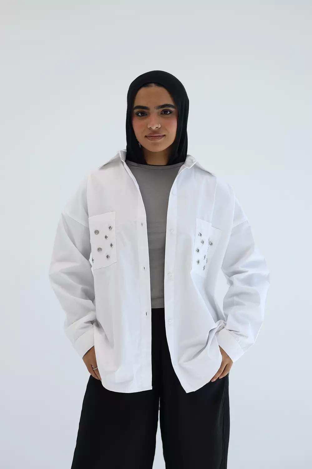 White shirt with metal circles on pockets image