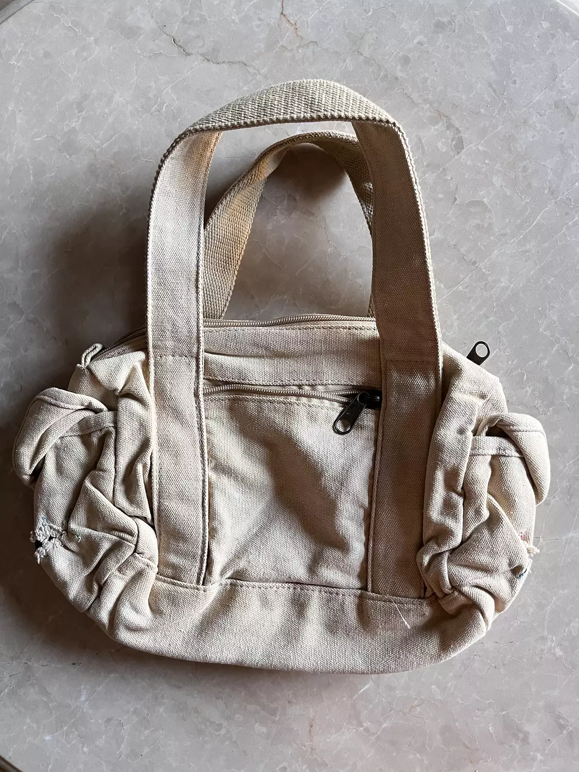 Beige ripped diesel bag with adjustable buttons  2