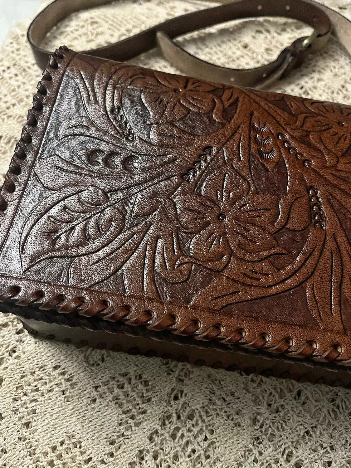Tooled floral rectangular flap leather bag hover image