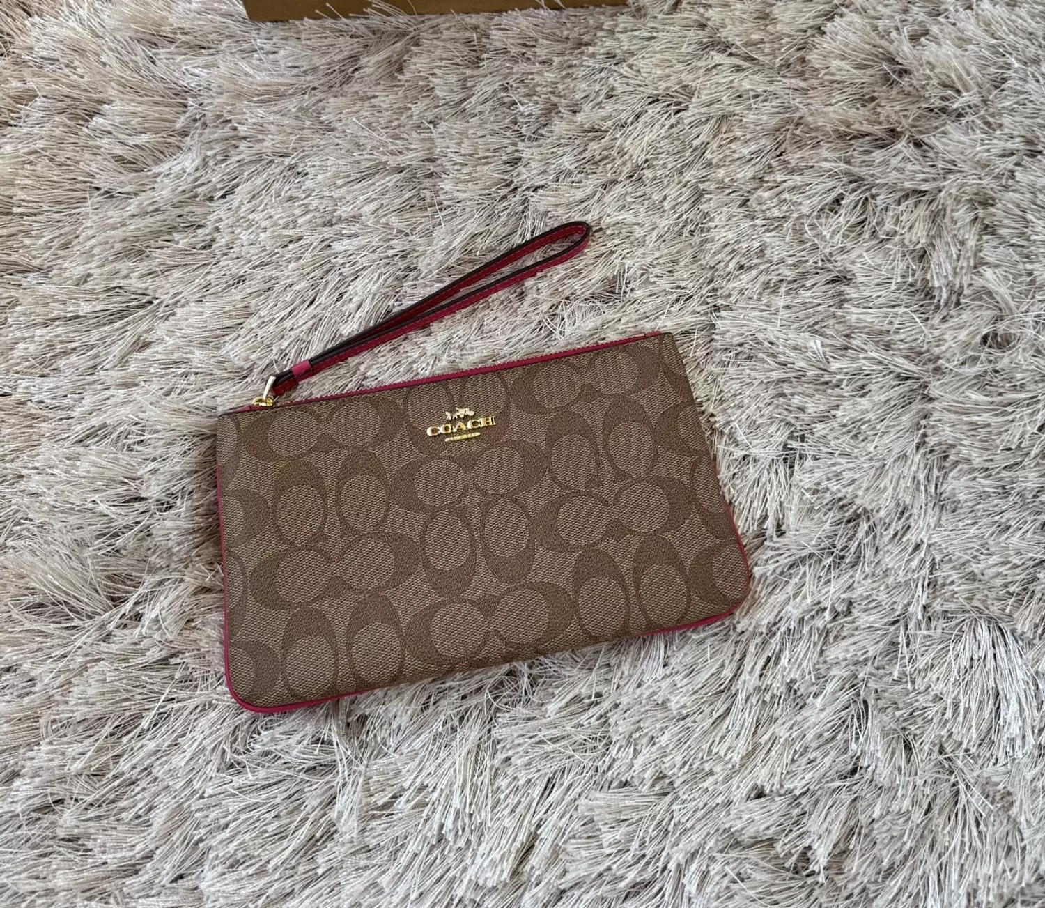 Coach wristlet in signature canvas tan brown pink stroke 1