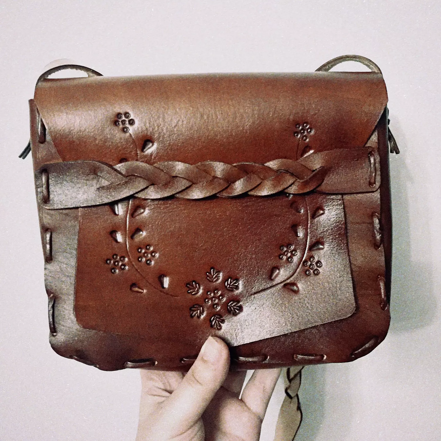 Tooled floral vines - braided strap leather bag image
