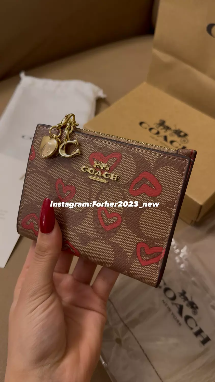 Coach bifold wallet with heart pattern  1