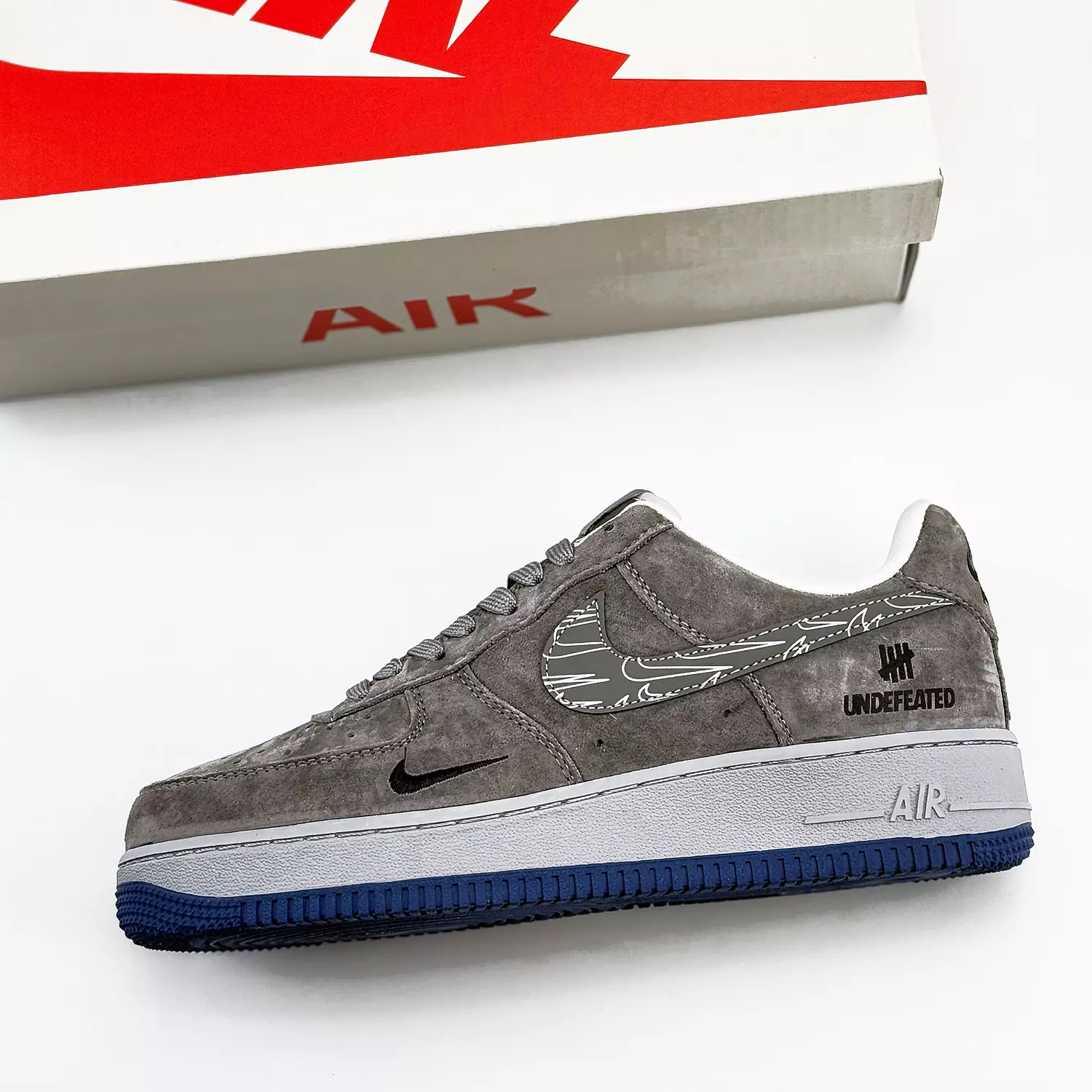 Nike Air Force 1 Low x UNDEFEATED in grey hover image