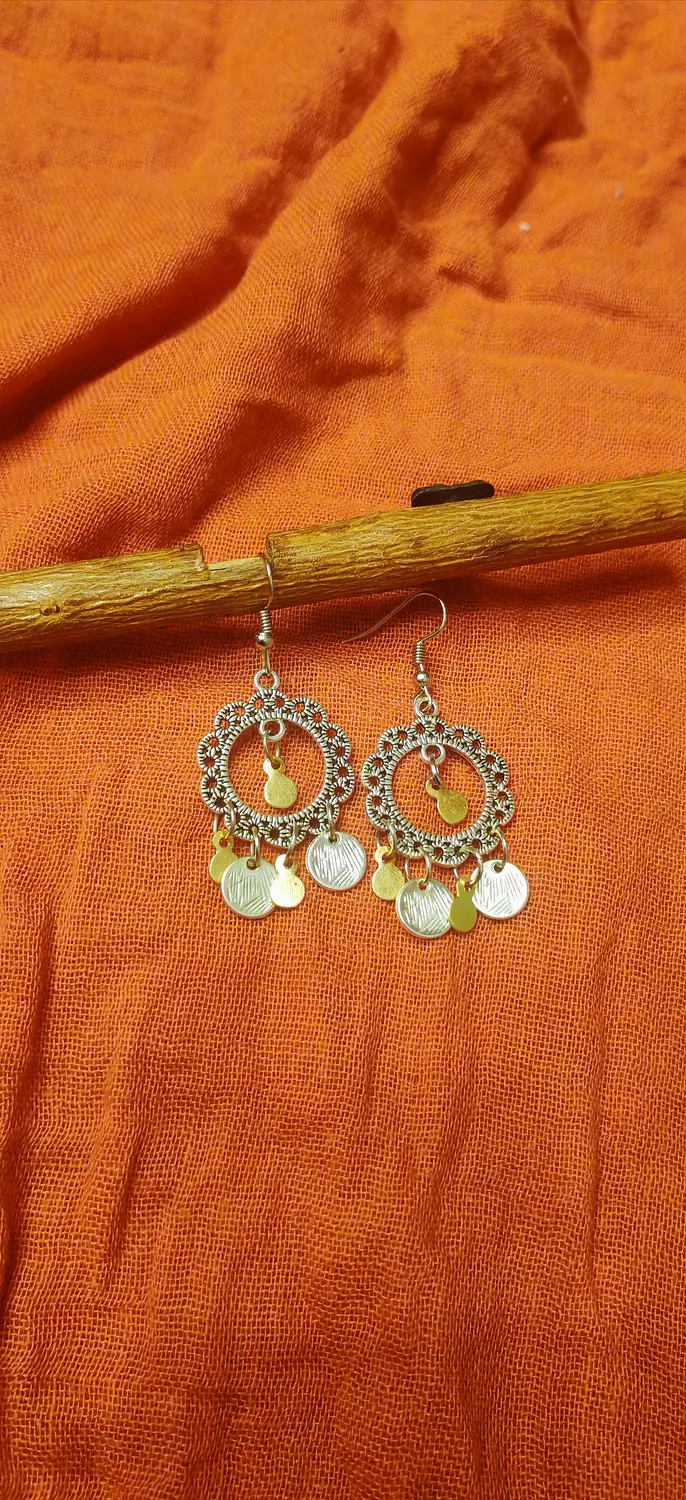 Medium sized silver color earrings with gold brass and silver pendants  hover image