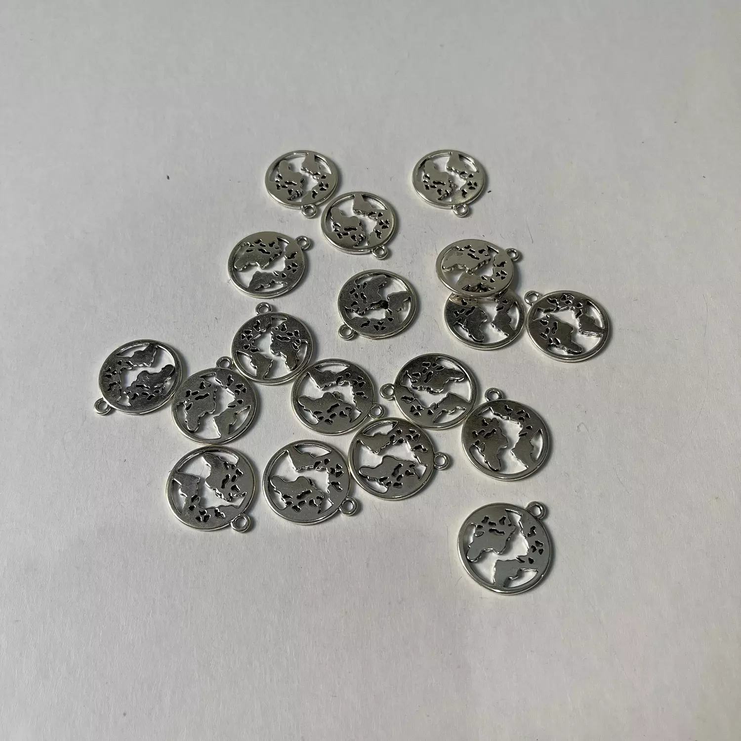 World map charm hover image