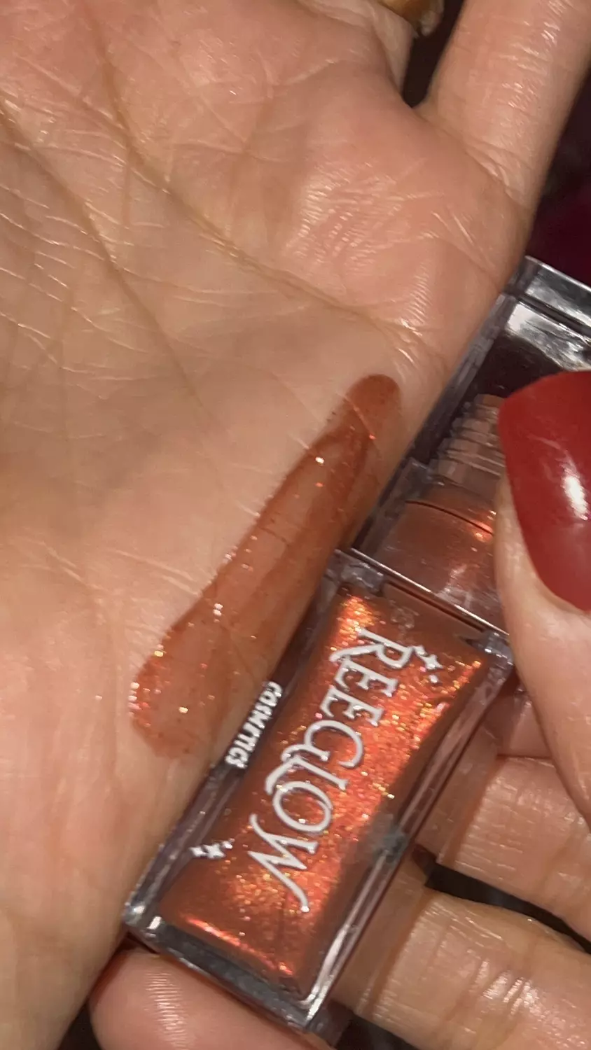 Shimmery soft brown lipgloss image