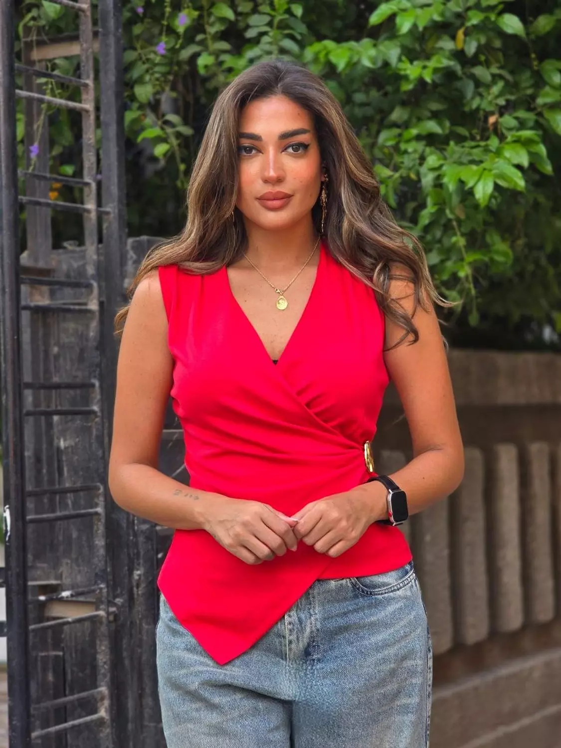 Red top with gold accessory  hover image