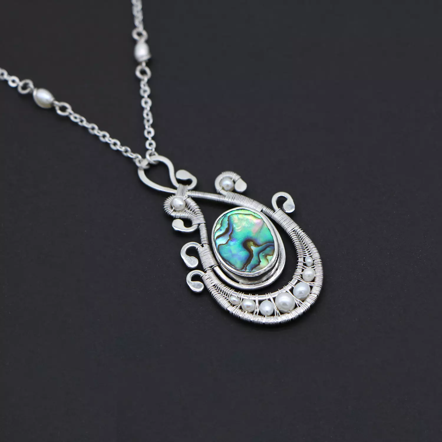 Necklace with abalone shell and pearls. image
