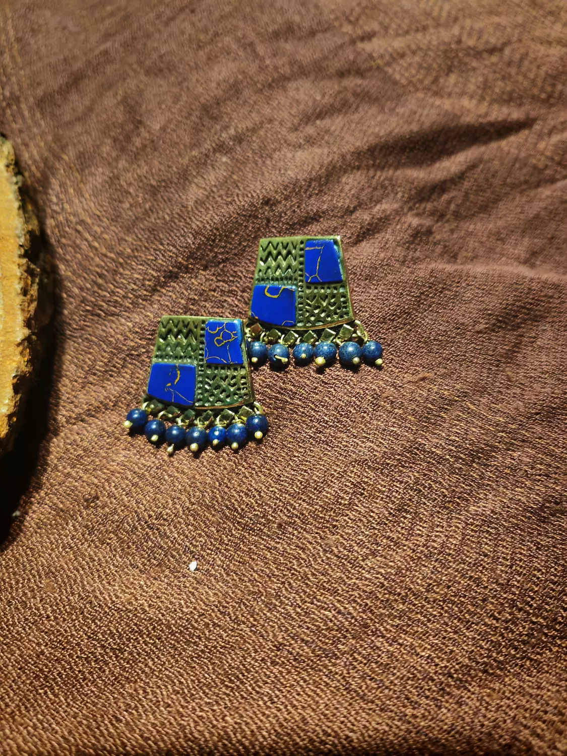 Brass earrings with blue stone hover image